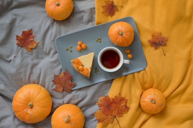 Pumpkin pastries cheesecake and a drink on the bed