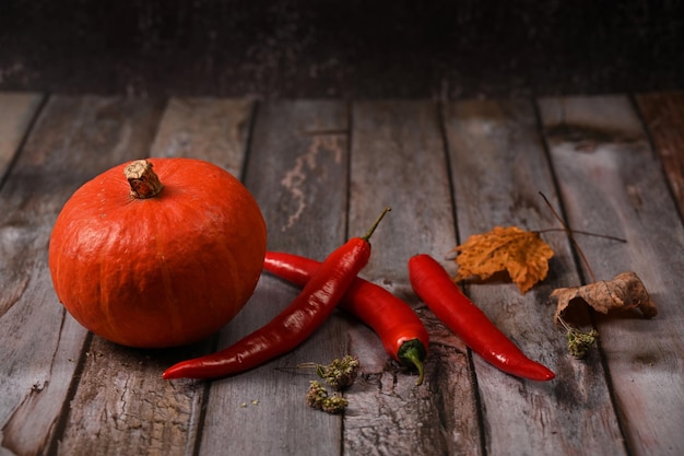 Pumpkin and pepper from the new crop lie on the table