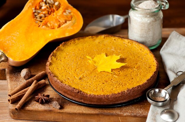 Pumpkin pie glutenfree on a wooden board in a rustic style