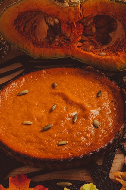 Pumpkin pie on wooden table. Dessert for thanksgiving dinner and pumpkin on wooden table.