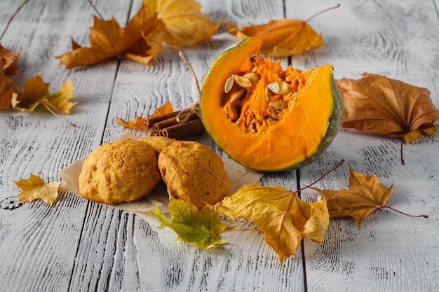 Pumpkin and pie on wooden table