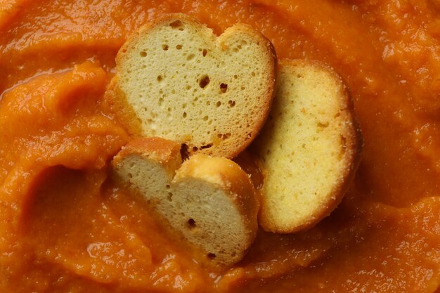 Pumpkin puree with croutons on whole, close up