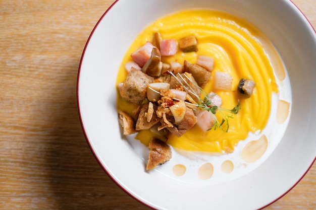 Pumpkin puree with ham and croutons Menu design concept for a restaurant