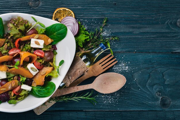 Pumpkin Salad Healthy food On a wooden surface Top view Free space for your text