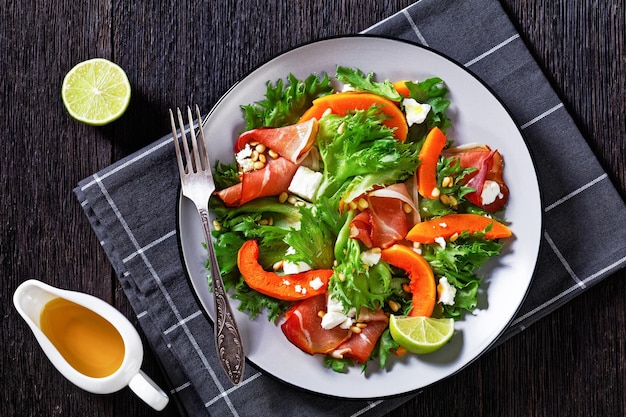 Pumpkin salad with lettuce crumbled cheese ham