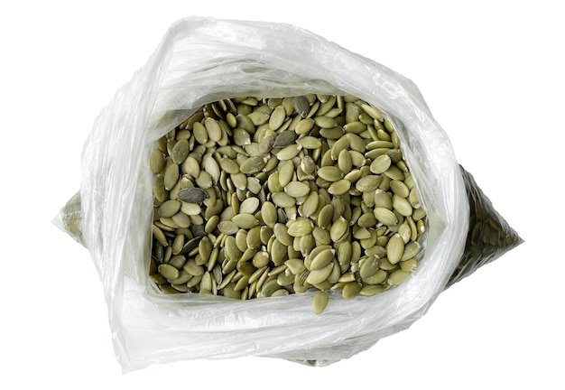 Photo pumpkin seeds in a bag on a white background