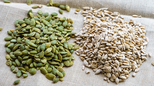 Pumpkin seeds and sunflower seeds on canvas