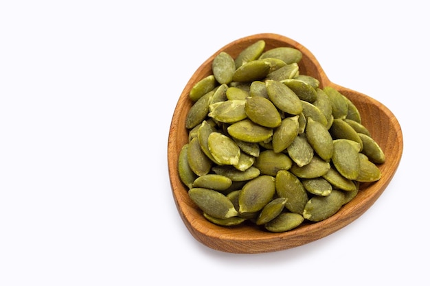 Pumpkin seeds on white background