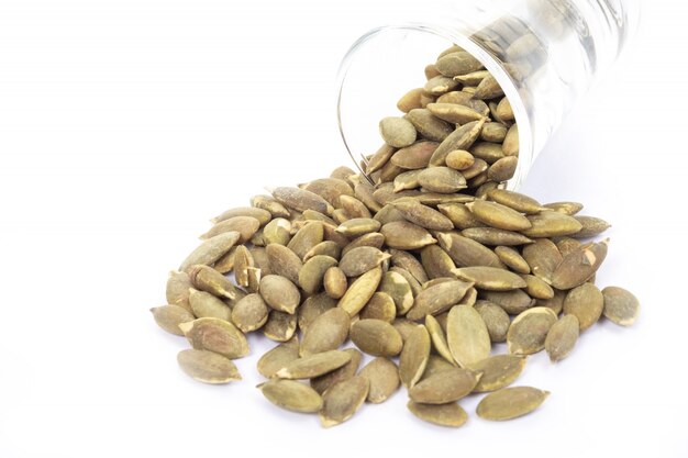 Pumpkin seeds on a white background