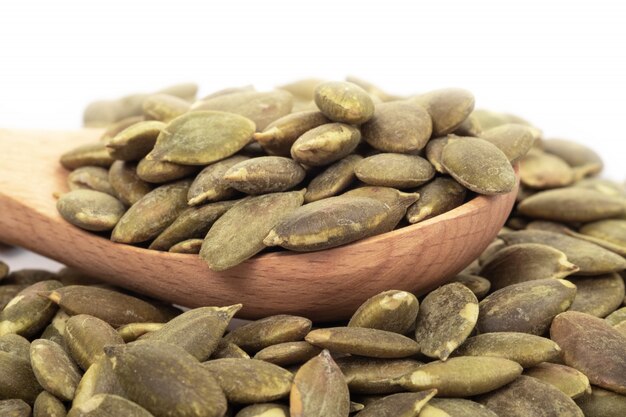 Pumpkin seeds on a white background