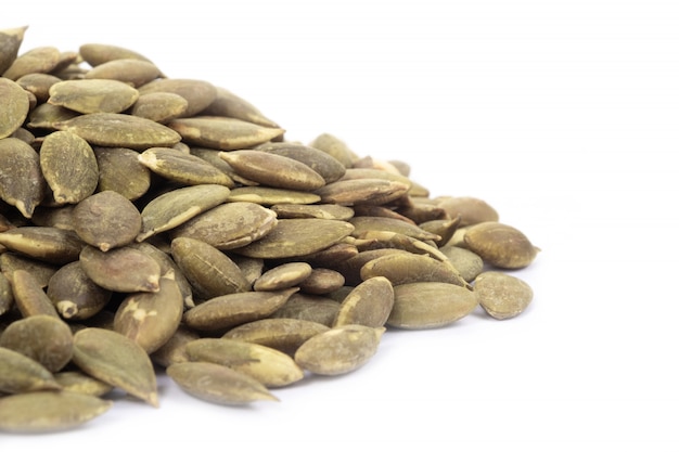 Pumpkin seeds on a white background