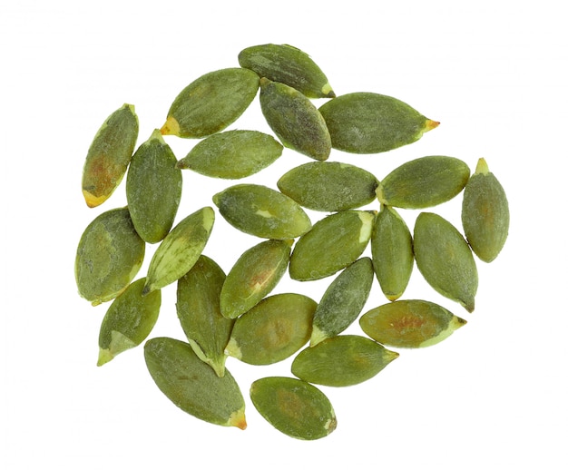 Photo pumpkin seeds on white wall