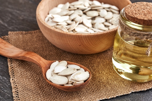 Pumpkin seeds and a wooden spoon