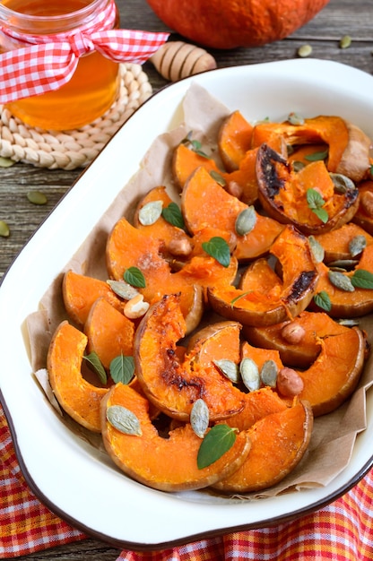 Pumpkin slices baked in the oven with honey, nuts, cinnamon and mint