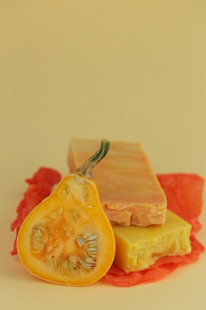 pumpkin soap. orange soap with pumpkin extract and a piece of fresh pumpkin