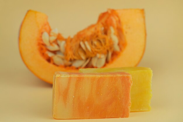 pumpkin soap. orange soap with pumpkin extract and a piece of fresh pumpkin