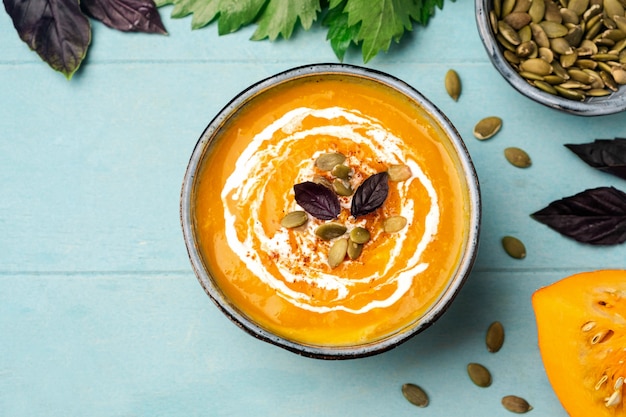 Pumpkin soup in a bowl, top view