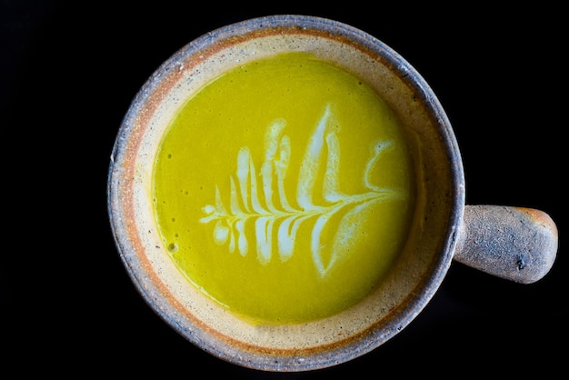 Pumpkin Soup isolated on black background top view