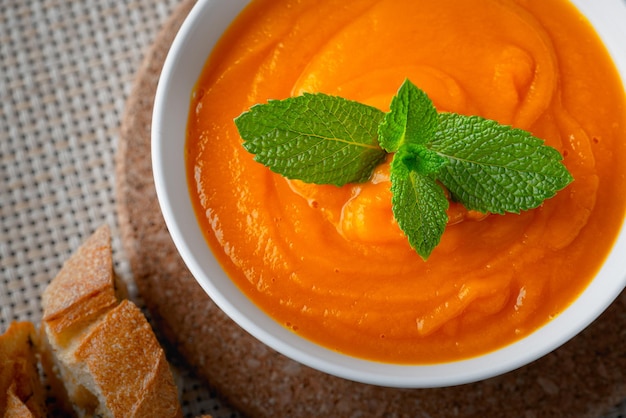 Pumpkin soup and mint on the table