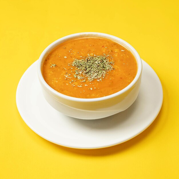 pumpkin soup in a white bowl