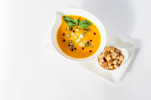 Pumpkin and soup with cream and pumpkin seeds