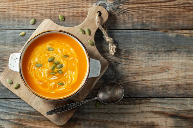 Pumpkin soup with croutons and cream.