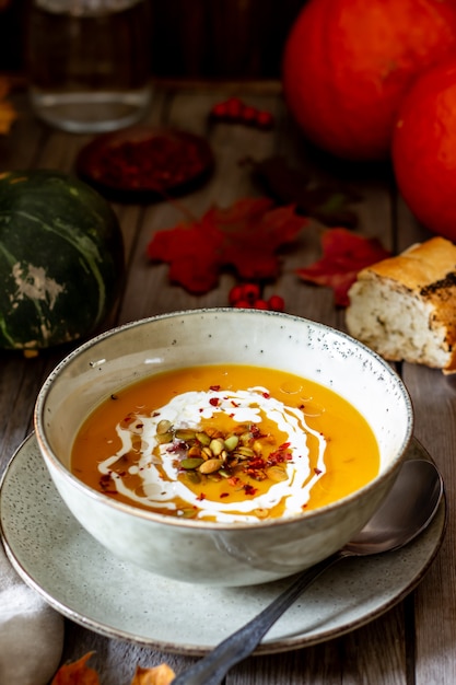 Pumpkin soup on a wooden . Healthy eating.