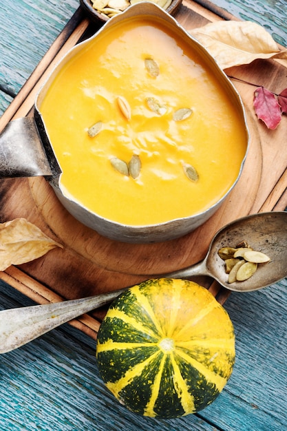 Pumpkin soup on a wooden table