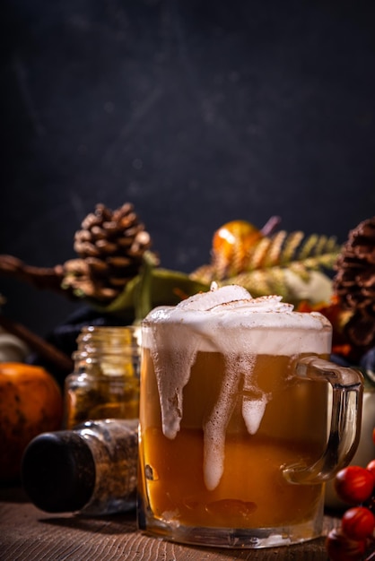 Pumpkin spice latte in a glass mug