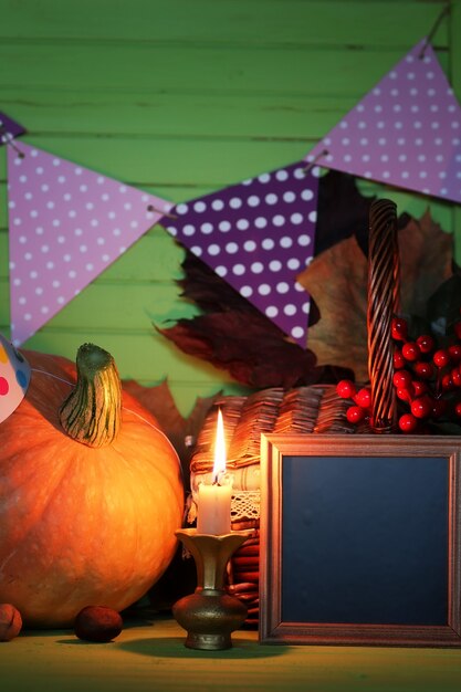 Pumpkin on the table holiday candle hat