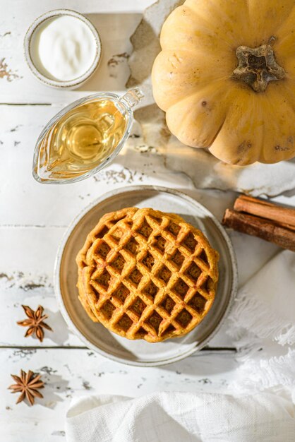 pumpkin waffles on a white wooden background