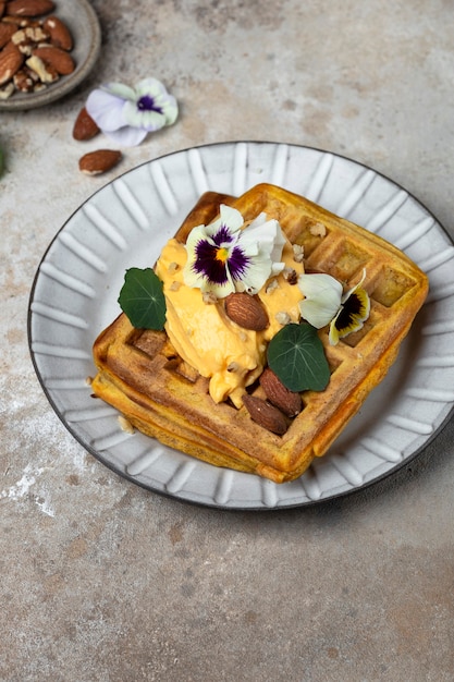 Pumpkin waffles with whipped sea buckthorn cream