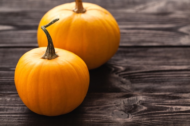 Pumpkin on wooden board black color.