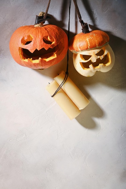 Pumpkins different size on light grey wall Carving A Pumpkin For Halloween