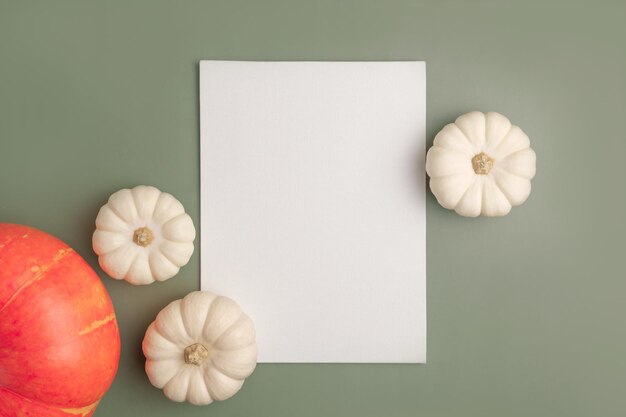 Photo pumpkins on green flat lay top view copy space nordicthanksgiving  modern invitation mock up