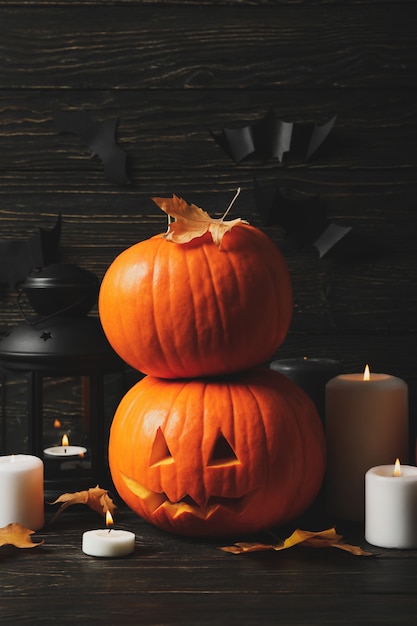 Pumpkins and halloween accessories on wooden