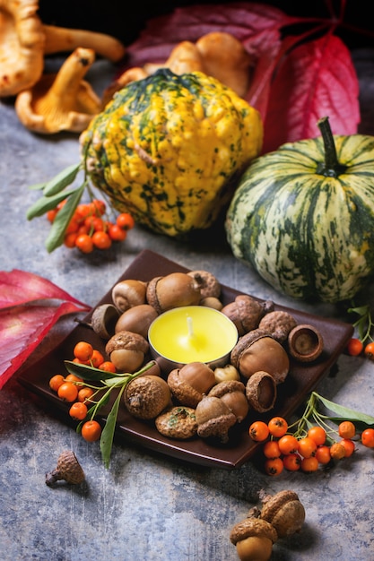 Pumpkins, nuts and candle