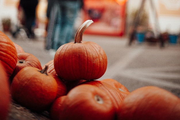 Pumpkins for sale at an outdoor market in autumn season