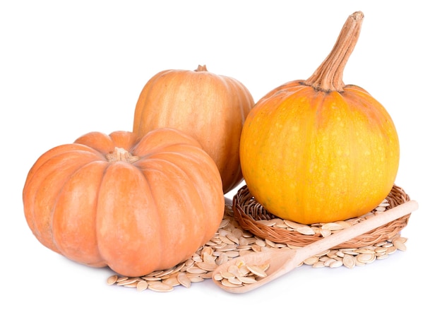 Pumpkins and seeds isolated on white