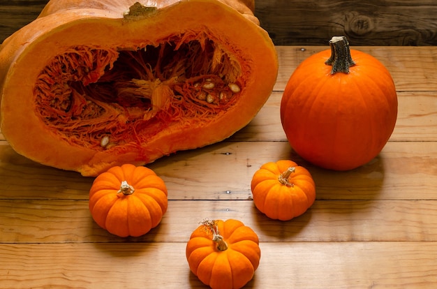 Pumpkins on table with autumn decoration