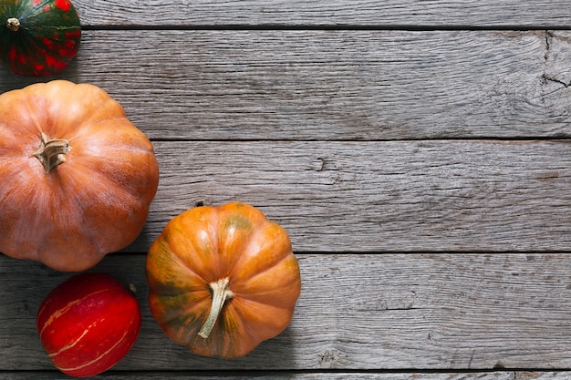 Pumpkins on weathered rustic wood table