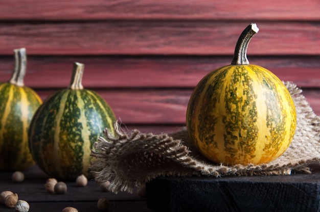 Pumpkins on wooden background