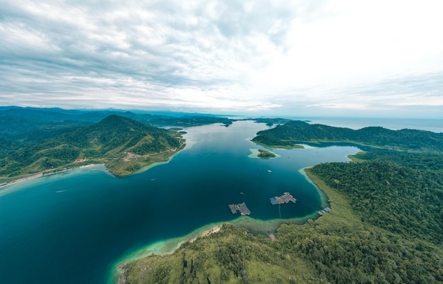 Puncak mandeh aerial view of a blend of natural hills with the beauty of the bay