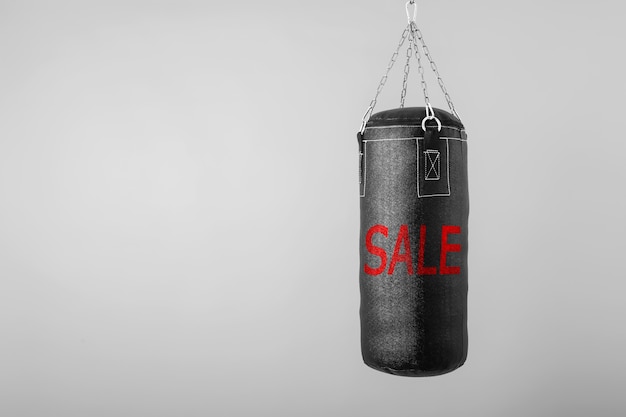 Punching bag hanging with text sale