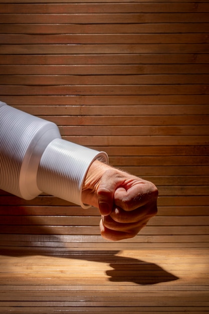 Punching a man's fist on a wooden table