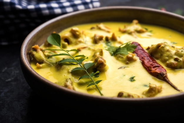 Punjabi Kadhi Pakoda or curry Pakora, Indian cuisine served in a bowl or karahi