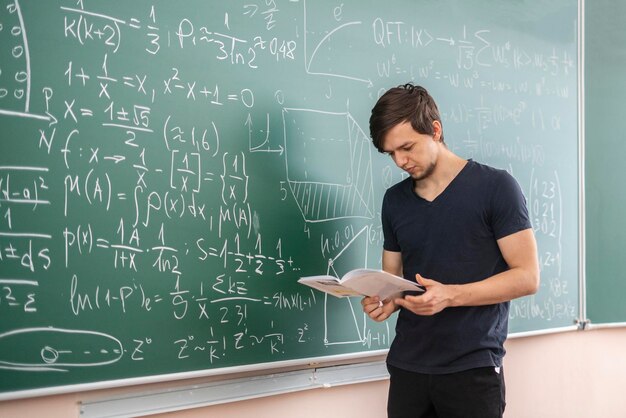 pupil doing homework on blackboard b