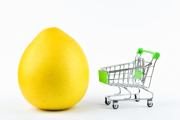Purchase pomelo trading concept. Shop online. Basket and pomelo on a white . healthy eating concept business concept