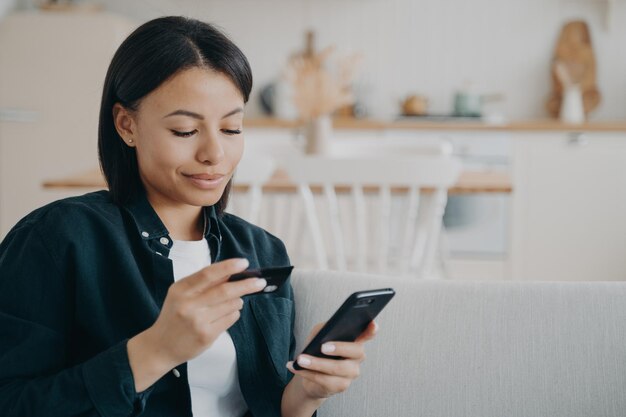 Purchasing online from home on quarantine Spanish girl ordering through internet