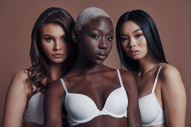 Pure beauty. Three attractive young women looking at camera 